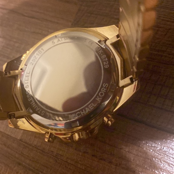 A brand new gold Micheal kors watch